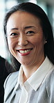 Happy, face or Asian woman in office with laugh, pride or ambition as investment advisor. About us, meeting or mature financial consultant with confidence, experience or risk management in Japan.