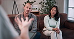 Couple, disagreement or fight with therapist for counseling, emotional support or helpful advice. Psychologist, man and woman with discussion for relationship assessment, trust or conflict resolution