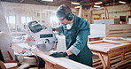 Bandsaw, carpentry and ppe with man in warehouse for manufacturing or production process. Earmuffs, eyewear and sawing machine with person in woodworking plant to resize lumber or timber for project