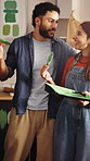 Talking, couple and happy with painting in kitchen for home upgrade, renovation and maintenance. Interior design, people and hug with paintbrush for DIY makeover, house improvement and decor support