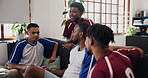 Relax, friends and men with discussion on couch, soccer competition forecast and trash talk rival team. Disagreement, argue and people speaking for sports game broadcast break, football fans and home