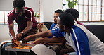 Happy people, soccer and eating with pizza on sofa for live game, entertainment or match in home. Group, friends or takeout food with football fans for social gathering or sport subscription in house