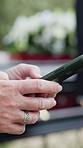 Funeral, texting and hands outdoor with phone, family arrangements or update on reception details. Digital, bokeh and person outside with tech, ceremony agenda or online chat at memorial service.