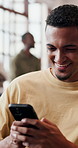 Laugh, phone and man in home for social media meme, joke or response to contact for communication. Mobile, funny and happy person in living room for relax, typing or humor with message on internet