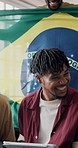 Soccer game, high five and men in house with tablet, goal celebration or live stream of sports tournament. Excitement, flag or fans on sofa with tech, score victory or football subscription in Brazil