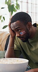 Disappointment, soccer game or black man on sofa with snacks, match loss or upset in sports tournament. Anxiety, food or football fan with frustration, score mistake or event results in Los Angeles.