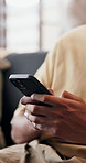 Hands, phone and typing in home for social media comment, response or contact for online dating. Mobile, person and text in living room for relax, connection or message for matchmaking on internet