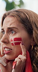 Watching tv, soccer and woman in home, nervous and frustrated for competition, anxiety and flag. Football, fan or person in lounge, match results or sports game with tournament announcement or stress