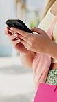Phone, typing and hands of woman with shopping bag in city for networking, texting or retail therapy. contact, tech and female person with cellphone for website discount, promotion or sale in town.