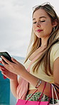 Phone, smile and woman with shopping bag in city for networking, texting or retail therapy. Happy, technology and female person with cellphone for website discount, promotion or sale in town.