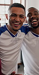 Face, support and friends in home for soccer, laugh or hug together for hangout with rival team. Portrait, men or football fans in apartment, funny group or excited people bonding at sports gathering