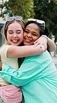 Happy women, friends and city with hug for love, support or social interaction on outdoor sidewalk. Female people, smile and friendship with smile or embrace for travel, catchup or greeting in town