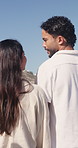 Outdoor, walking and happy couple with conversation for holiday, romantic trip and support for journey. Nature, discussion or people with bonding for healthy relationship, travel or explore together