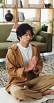 Yoga, man and meditation with prayer hands in house for stress relief, inner peace and mindfulness. Calm, person and namaste pose on mat for zen practice, spiritual healing and align chakra in home