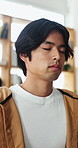 Asian man, breathe and yoga with meditation at house for zen, spiritual healing and mindfulness. Male person, yogi and eyes closed with breathwork, inner peace and holistic balance for stress relief