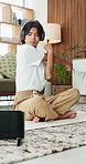 Exercise, stretching and tablet with yoga man in home living room for balance or flexibility. App, cobra pose and headphones with Asian person on floor in apartment for fitness or wellness activity
