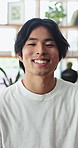 Wellness, face and Asian man in house with laugh, positive attitude or chill on weekend break. Confidence, portrait or male person in home with happiness, comfortable or good mood in free time.