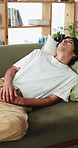 Relax, thinking and man with stress on sofa for college loan, scholarship risk or mental health. Student, frustrated asian or rest in home for university pressure, financial study debt or overwhelmed