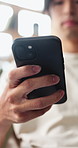 Typing, hands and Asian man on sofa with phone for social media, online dating and connection. Weekend, home and person on smartphone for reading message, website and notification in living room