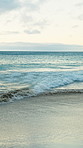 Beach, ocean water and waves for holiday, summer vacation and location for travel with empty coast. Sea, horizon and tourism destination with sky view, clouds and nature outdoor in California