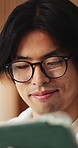 Glasses, man or smile with tablet in home for college portal, study registration or approval. Asian student, app or eyewear reflection in house for university admission, acceptance email or good news