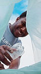 Low angle, pov and people with trash bag for sustainability, recycling and reduce pollution. Volunteer, outdoor and happy friends with climate change, environment and community service for earth day