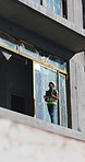 Construction, walking and man on tablet in building for urban planning, research and blueprints. Contractor, architecture and person on digital tech for renovation, maintenance or engineering project