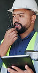 Tablet, radio and construction worker on site with research for building, renovation or repairs. Notification, talking and male civil engineer with digital technology for email on inspection approval