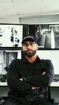 Face, monitor and man in security room, arms crossed and surveillance system for protection. Professional, person and operator in workplace, pride or confidence for camera footage and safety service