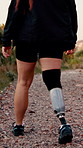 Legs, fitness and prosthetic limb for hiking with exercise, workout and health with space. Prosthesis, nature and person with a disability outdoor for adventure, hobby and rehabilitation on mountain