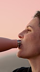 Morning, nature and woman with water for exercise, hiking and trekking for health or wellness. Mountain, outdoor and person with bottle, liquid and hydration for adventure, fitness and workout