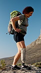Woman, fitness and prosthetic leg for backpacker with exercise, workout and health with walk. Hike, nature and person with a disability outdoor for adventure, hobby and rehabilitation on mountain