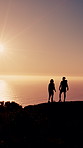 Hiking, mountain and back of couple at sunrise with prosthetic leg for adventure, exercise and workout. Nature, morning and person with disability for wellness, health or fitness for walking together