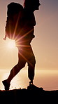 Hiking, mountain and woman with prosthetic leg for adventure, exercise and cardio workout. Nature, morning and person with disability for wellness, walking and fitness for journey, health or travel