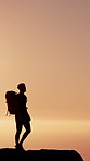 Ocean, hiker and man with view, silhouette and hobby in nature, sunset and exercise. Outdoor, hiking and person with water, summer holiday and trekking for healthy benefits, tourism and reflection