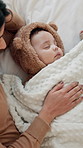 Sleeping, mother and baby in bedroom, above and tired with cuddle, relax and bonding together. Comfort, happy family and parent in home, growth and fatigue with love, mama and blanket for infant care