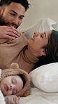 Sleeping, parents and baby in bedroom, talking and tired with cuddle, relax and bonding together. Comfort, happy family and smile in home, support and mother with father, discussion and infant care