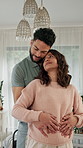 Dancing, couple and pregnant woman with kiss in home together, touch stomach or affection for connection. Love, maternity support or happy people with hug for healthy relationship, care or admiration