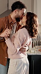 Dancing, couple and pregnant woman with kiss in kitchen together, bonding and affection for connection. Home, maternity support and people with smile for healthy relationship, love or moving to music