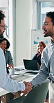 Businessman, handshake and happy at office meeting with team, goals and success at insurance company. People, shaking hands and smile for promotion, thanks or celebration for risk management agency
