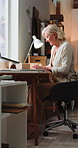 Woman, typing and laptop at ecommerce startup for supply chain, confirm order and shipping report. Mature person, pc and online email for stock inquiry, inventory management and delivery information