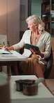 Logistics, tablet and writing with woman in office for delivery, distribution or stock management. App, inventory notes and supply chain with mature courier in plant for shipping manifest or service