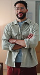 Face, confidence and man in small business for logistics, shipping and supply chain in office. Arms crossed, portrait or happy entrepreneur, distribution or procurement worker in workplace with pride