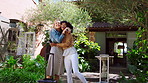 Freedom, hug and luggage with friends at lodge together for celebration, holiday or travel. Arms raised, suitcase and vacation with happy women outdoor at guest house for accommodation or hospitality