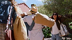 Happy people, friends or destination with group on vacation for travel in natural holiday resort. Community, tourist or excited travelers with smile in nature for outdoor getaway or check in together