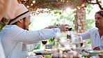 Lunch, friends and toast with wine at garden, bonding and laughing together at social gathering. Men, women and cheers with glass outdoor, serving food and funny joke with group at reunion party