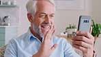 Video call, phone or old man in lounge with wave, connection or hello in online conversation. Happy, tech or senior person in house with friendly gesture, communication or greeting on digital app.