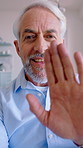 Face, wave and old man in home with video call, communication or sign language for I miss you message. Deaf, senior person and greeting in house with virtual contact, goodbye or ASL for conversation.