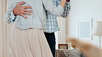 Couple, holding hands and dance with hug in home for movement, romance and bonding together. People, embrace and sway with rhythm in lounge, romantic song and partner support for marriage commitment