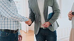 Hands, couple or handshake with real estate agent in new home for property sale, purchase or approval. Moving, buyers and thank you to realtor for ownership transfer, mortgage success and investment